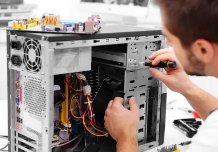 Desktop repair service in Al Barsha Dubai — technician diagnosing PC motherboard